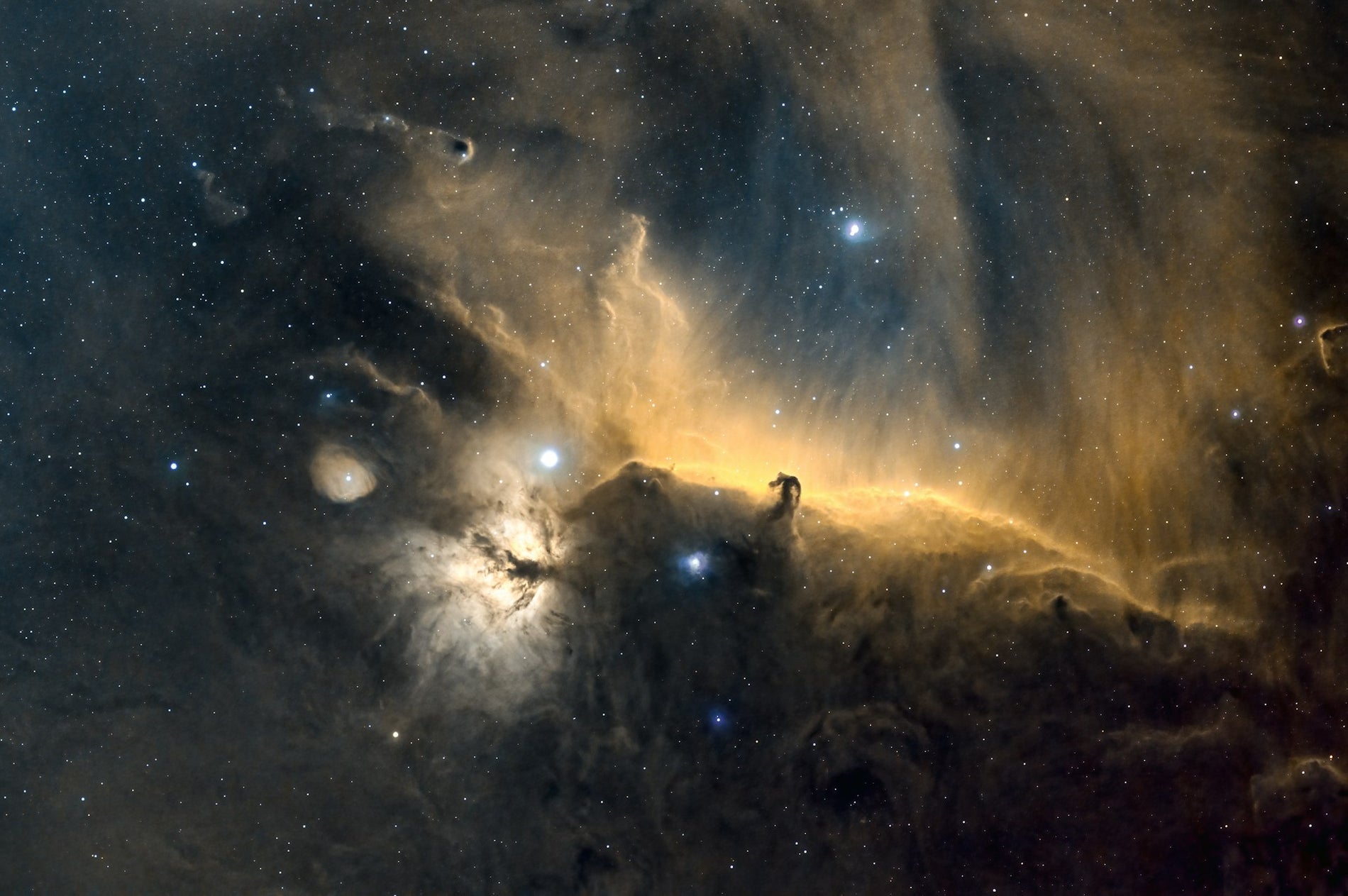 Horsehead and Flame Nebula — dark cosmos. Photo by Arnaud Girault on Unsplash