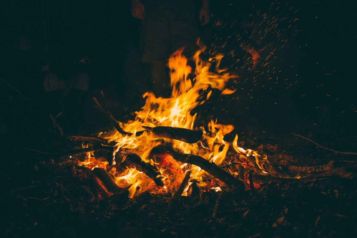 Burning firewood glowing at night