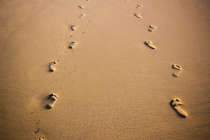 Footprints on brown sand