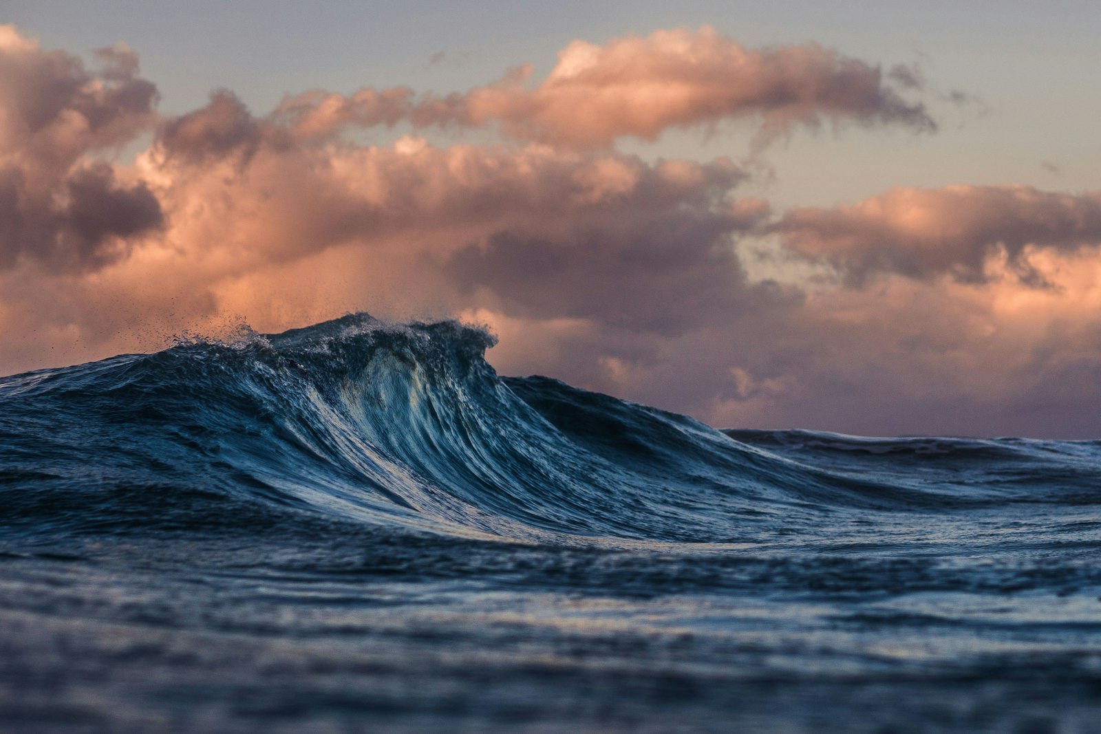 Powerful sea waves rolling beneath an open sky