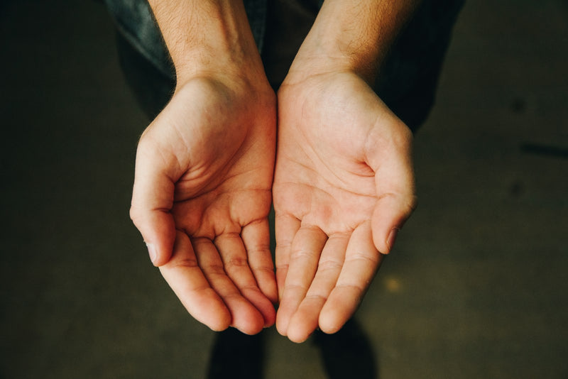 Two open hands held together with palms facing upward