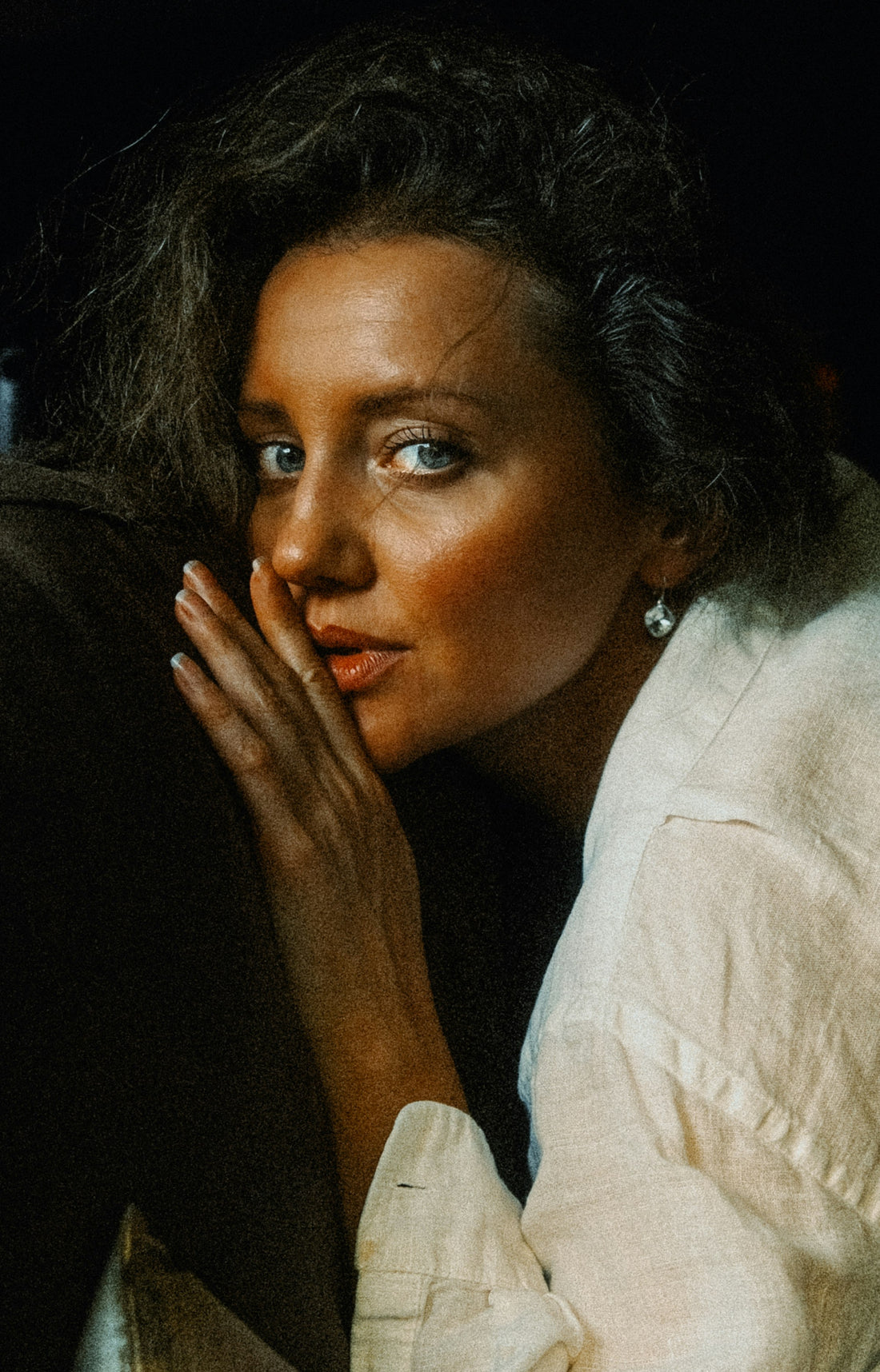 Woman whispering with her hand over her mouth — the unnamed servant girl who spoke one sentence and changed everything. Photo by Artem Artemov on Unsplash.